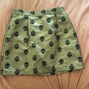 Size 12 ModCloth skull skirt. Great condition. Gold with black skulls.